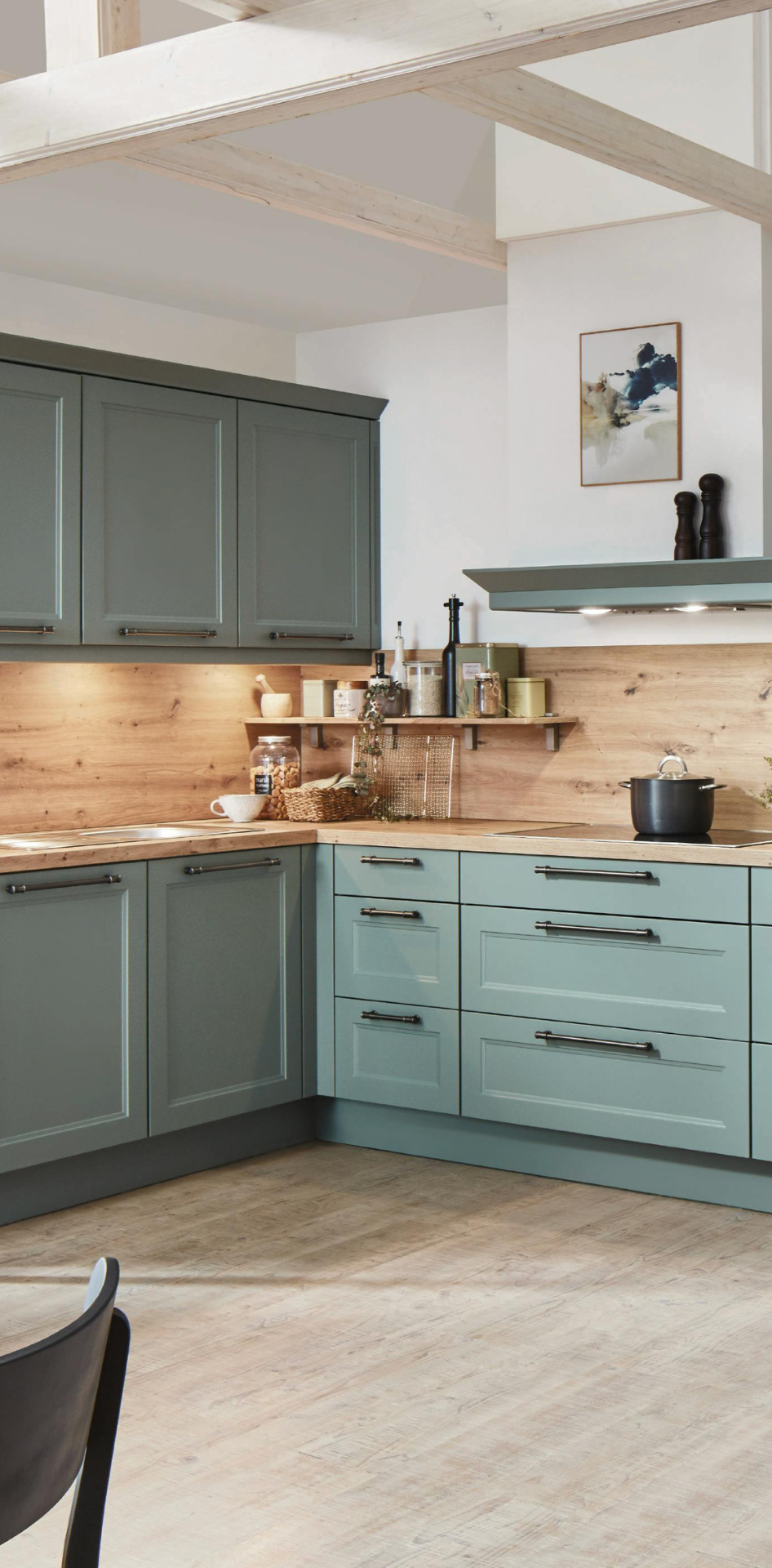 Modern kitchen with green cabinets and wooden countertops